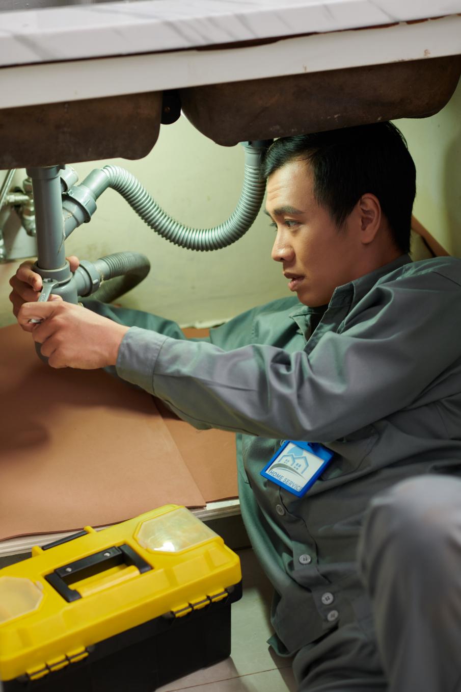 Plumber using professional tools